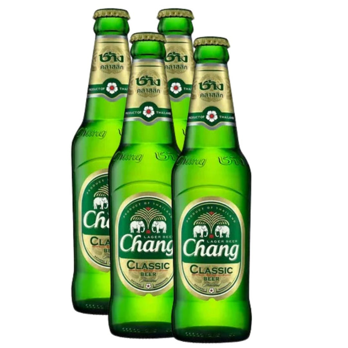 Chang Classic Beer product shot. Green bottle with a green oval label that depicts 2 elephants. Photographed on a white background.